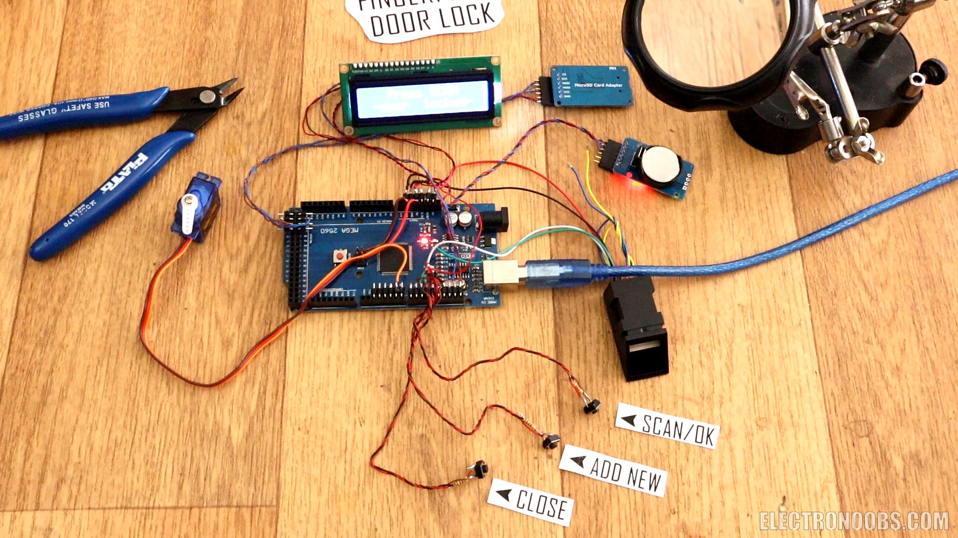 A fresh door lock prototype featuring a 3D?printed housing, servo mechanism and integrated RFID reader.