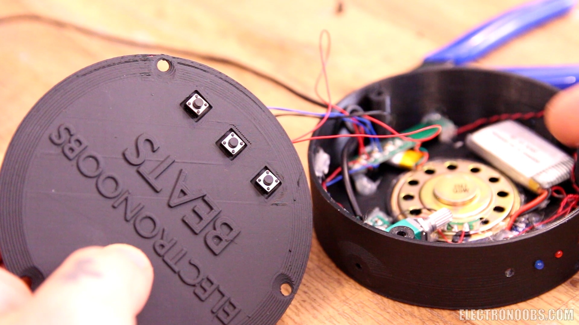 Homemade Bluetooth headphones in a 3?D printed case, showing the circuit board and parts list.