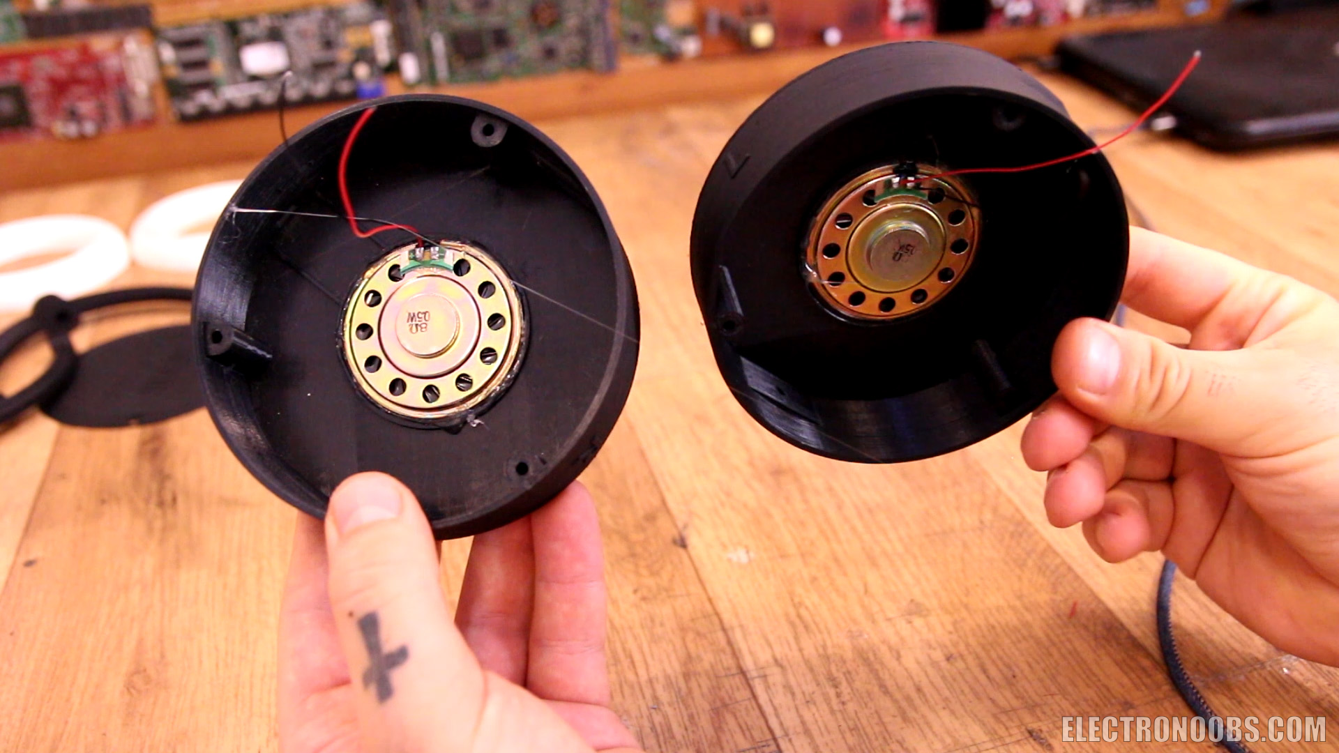 Homemade Bluetooth headphones in a 3D?printed case, showing the circuit board and parts list eliminating hiss.